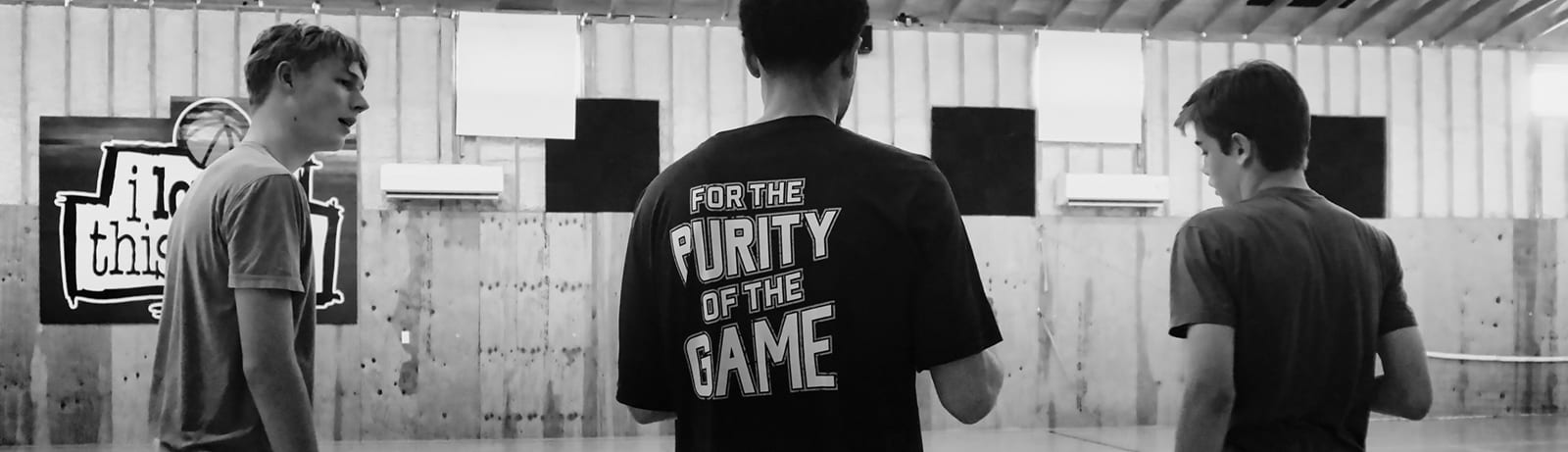 Three players in a Pure Basketball session, one in the For the purity of the game shirt